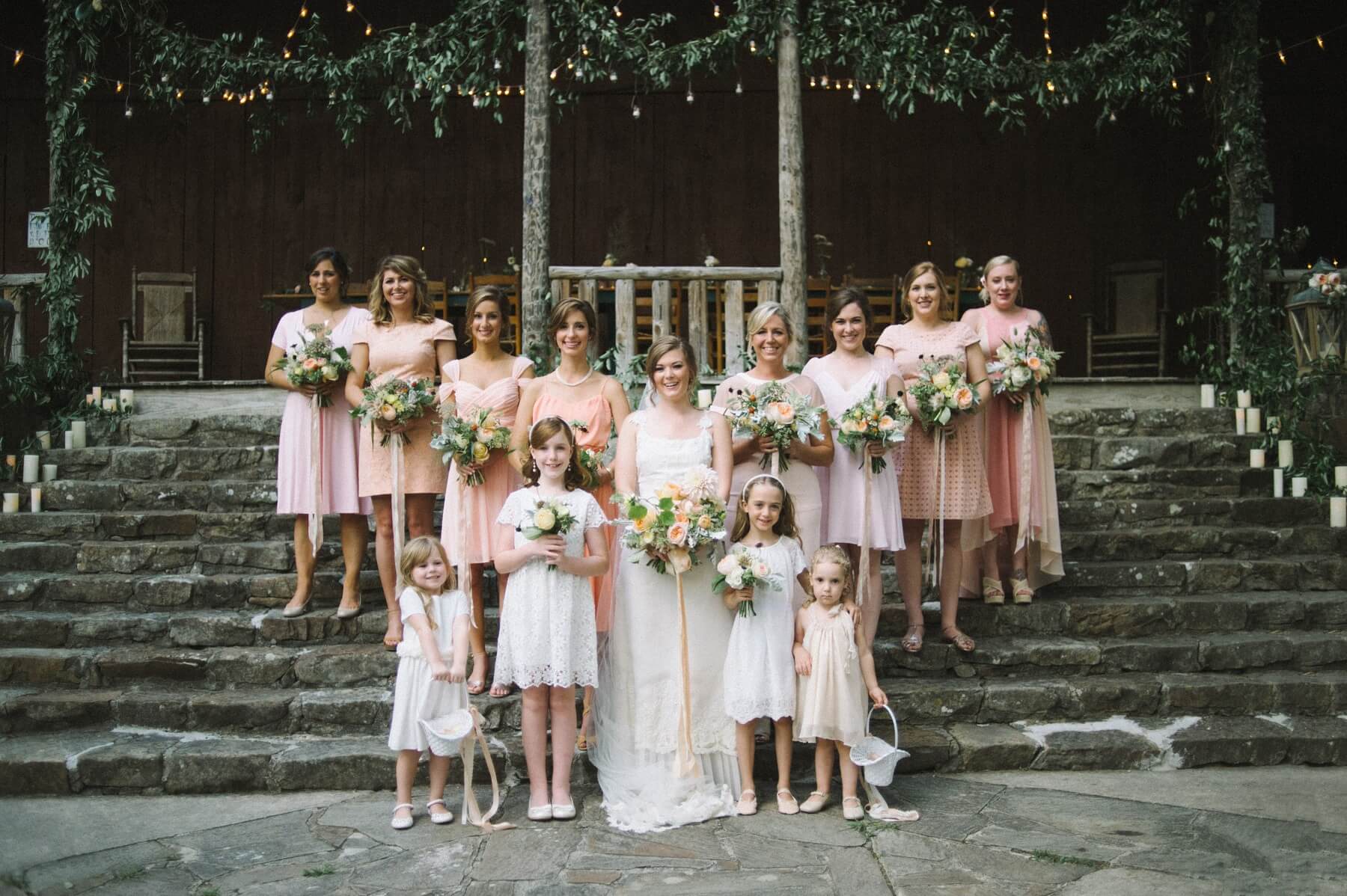 Dawn asked her bridesmaids to choose their own dresses in shades of soft blush and dressed her darling flower girls in casual white frocks. We love the relaxed yet elegant look this gorgeous group of ladies so effortlessly exudes!