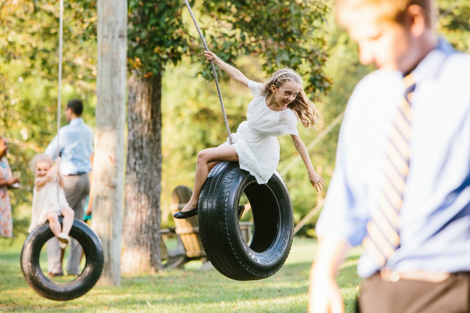 Kids were truly in their element at the Riley-Bains wedding. How many weddings come complete with tire-swing entertainment?
