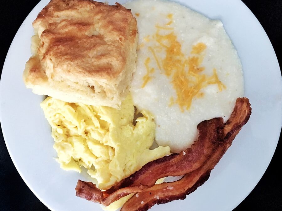 Mama's Boy breakfast, with biscuit, bacon, eggs and grits.