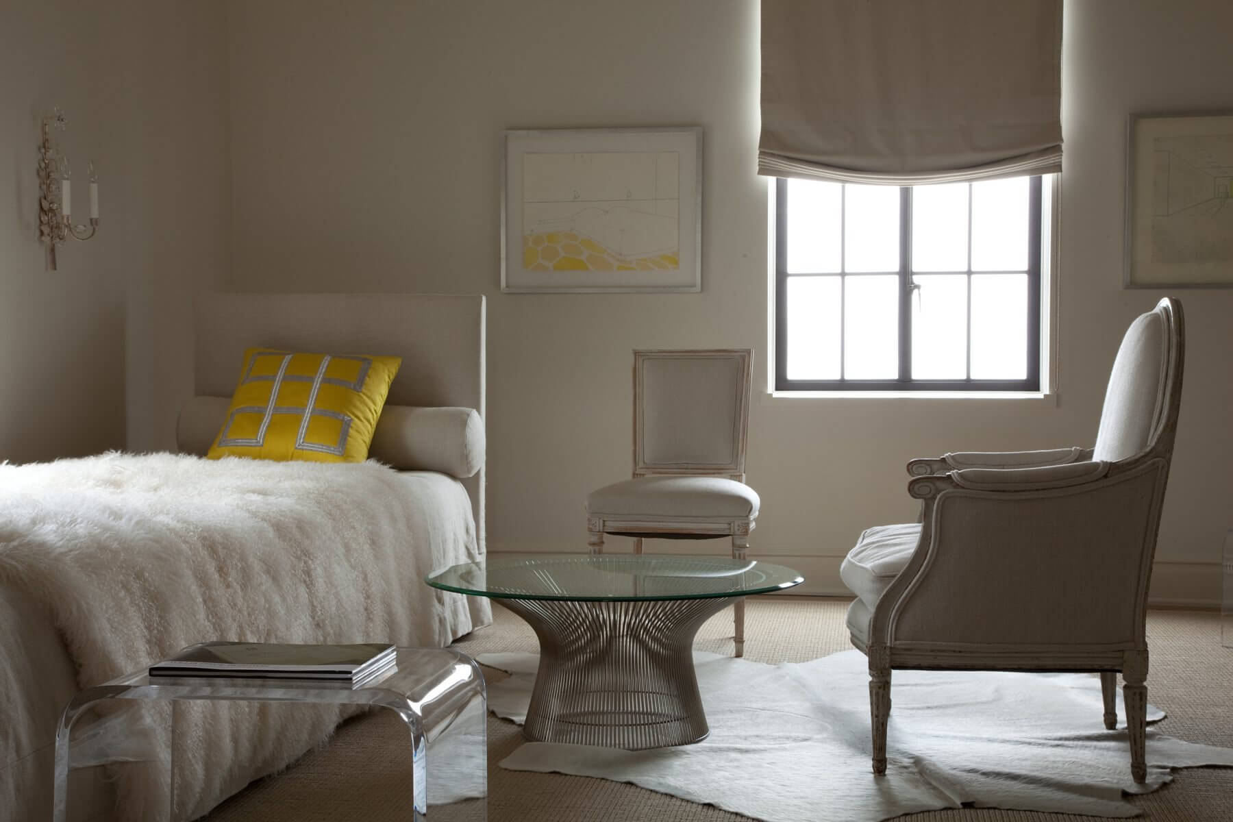 The daughter enjoys a Louis XVI Bergère and side chair, a Warren Platner coffee table and a Mongolian throw from Paige Albright Orientals at foot of her bed. Image: Miller Mobley