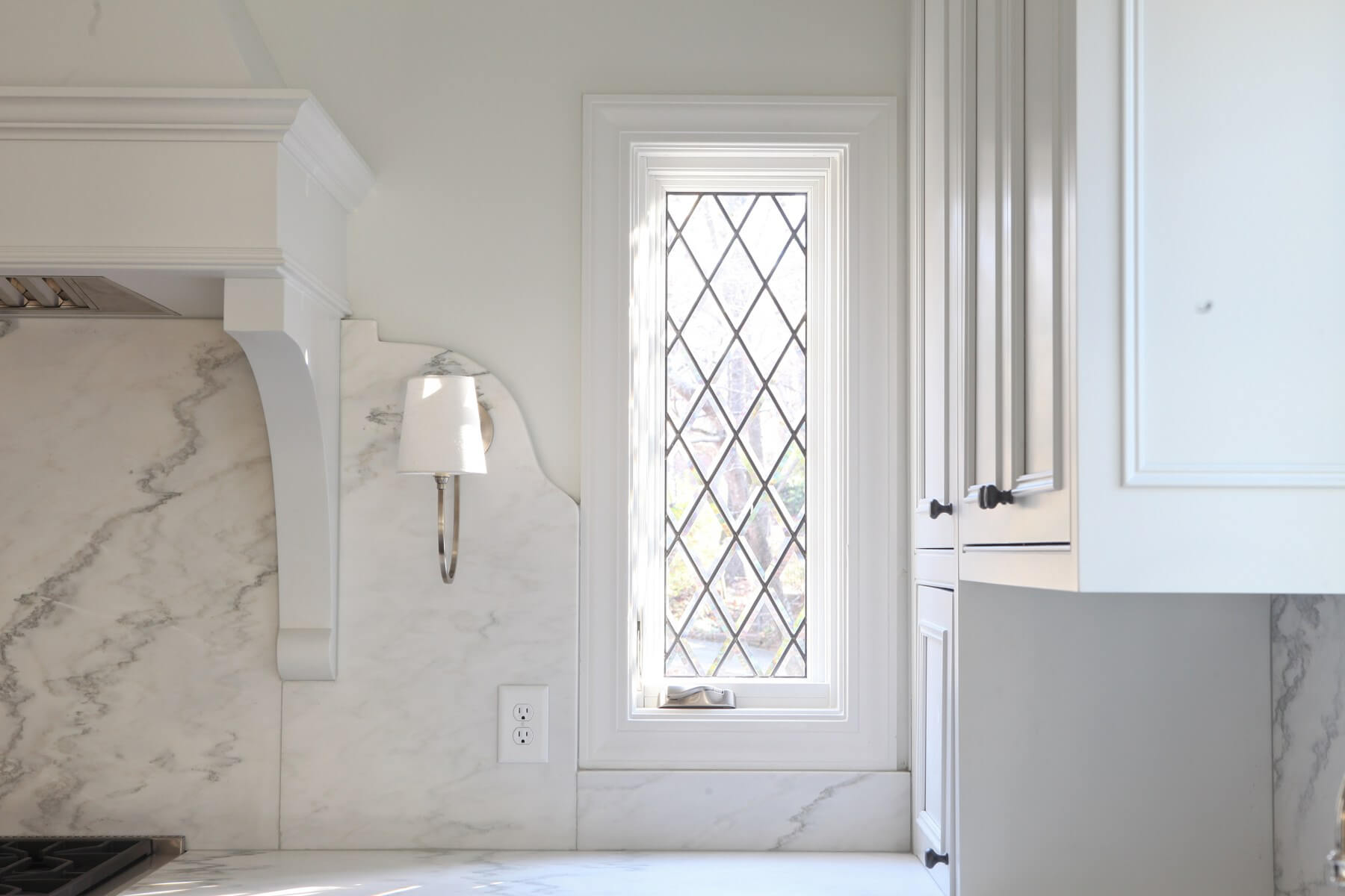 "By adding narrow rectangular leaded glass windows, we instantly added architectural character that so many houses built after the '60s are lacking," says Cyndy.
