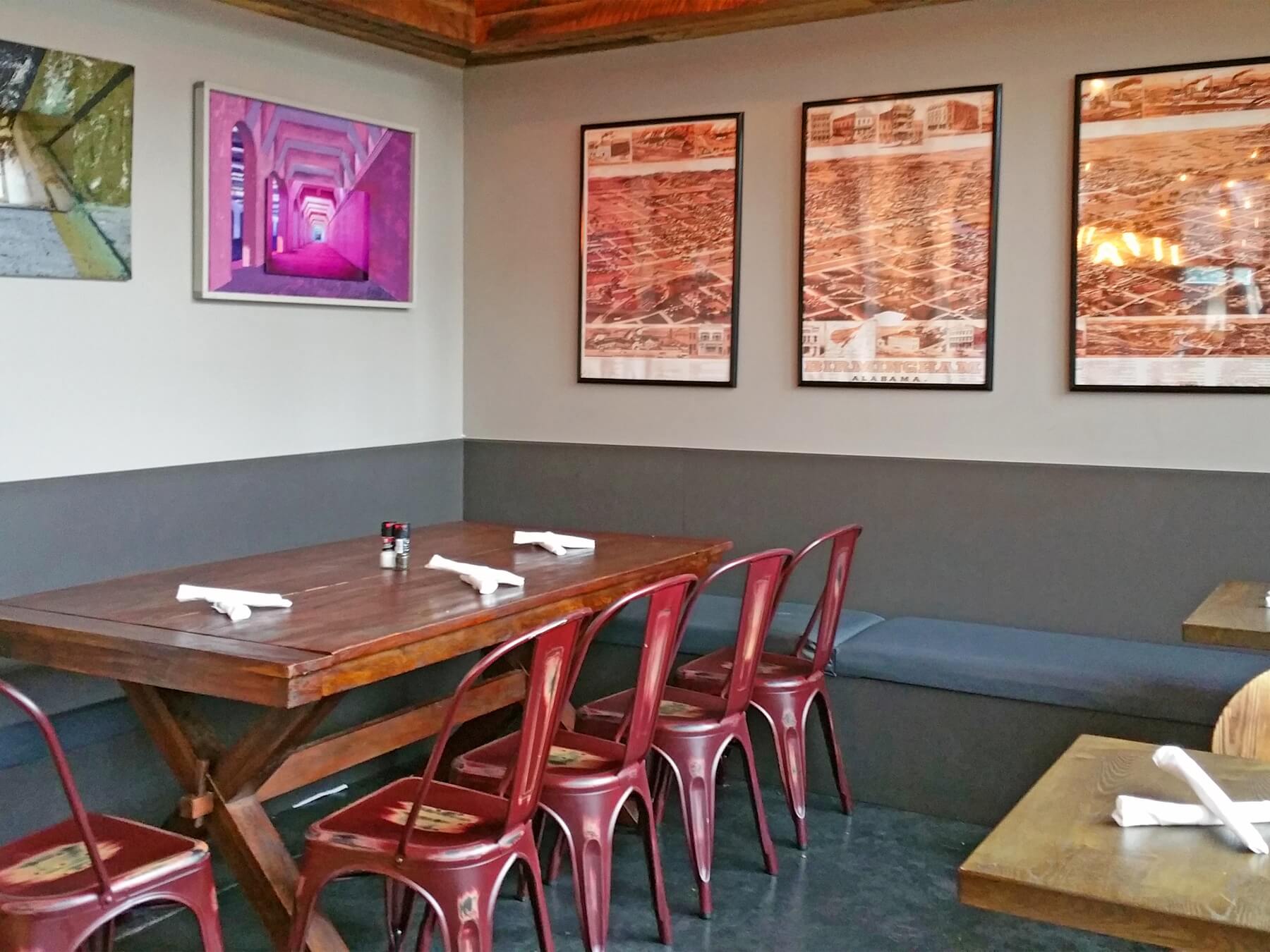 Vintage prints of Birmingham maps and collaborative mixed media pieces, featuring the art of Joseph Longoria and the photos of Ginnard Archibald, give this eatery the stamp of Birmingham pride. Vintage prints of Birmingham maps and collaborative mixed media pieces, featuring the art of Joseph Longoria and the photos of Ginnard Archibald, give this eatery the stamp of Birmingham pride.