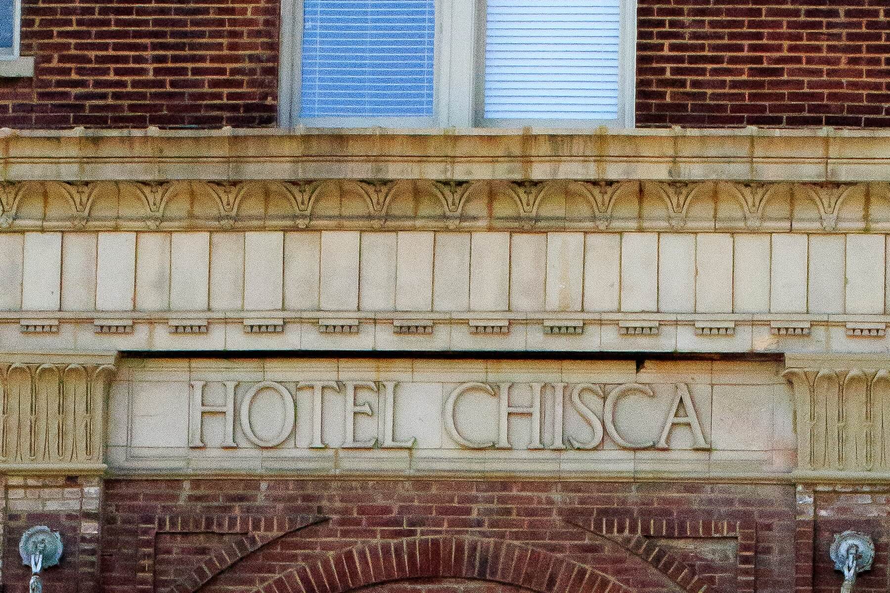 The buidlng boasts the original architectural details, including the hotel lettering.