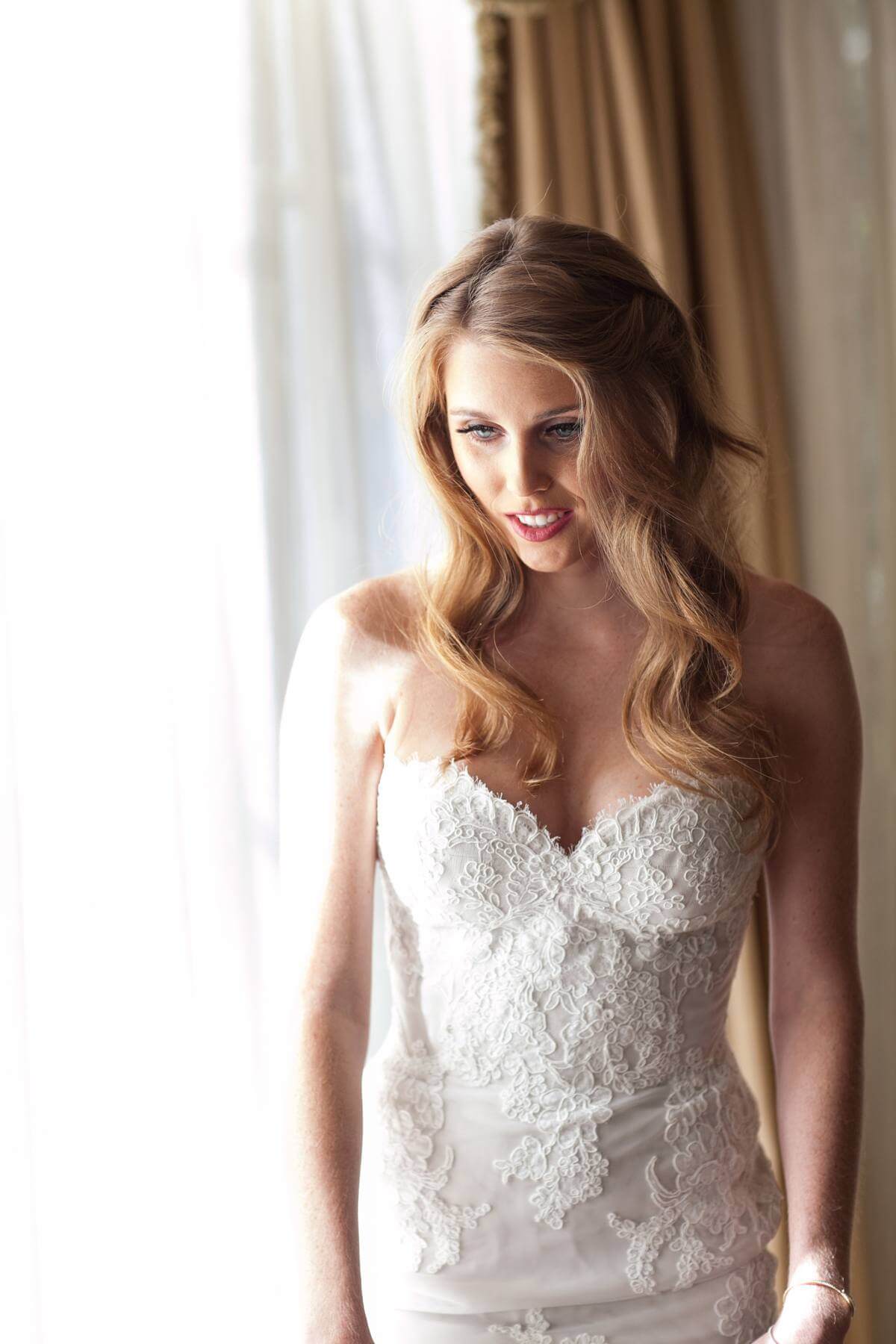 She never expected to go with a strapless wedding dress but she fell in love with the fit and lace.