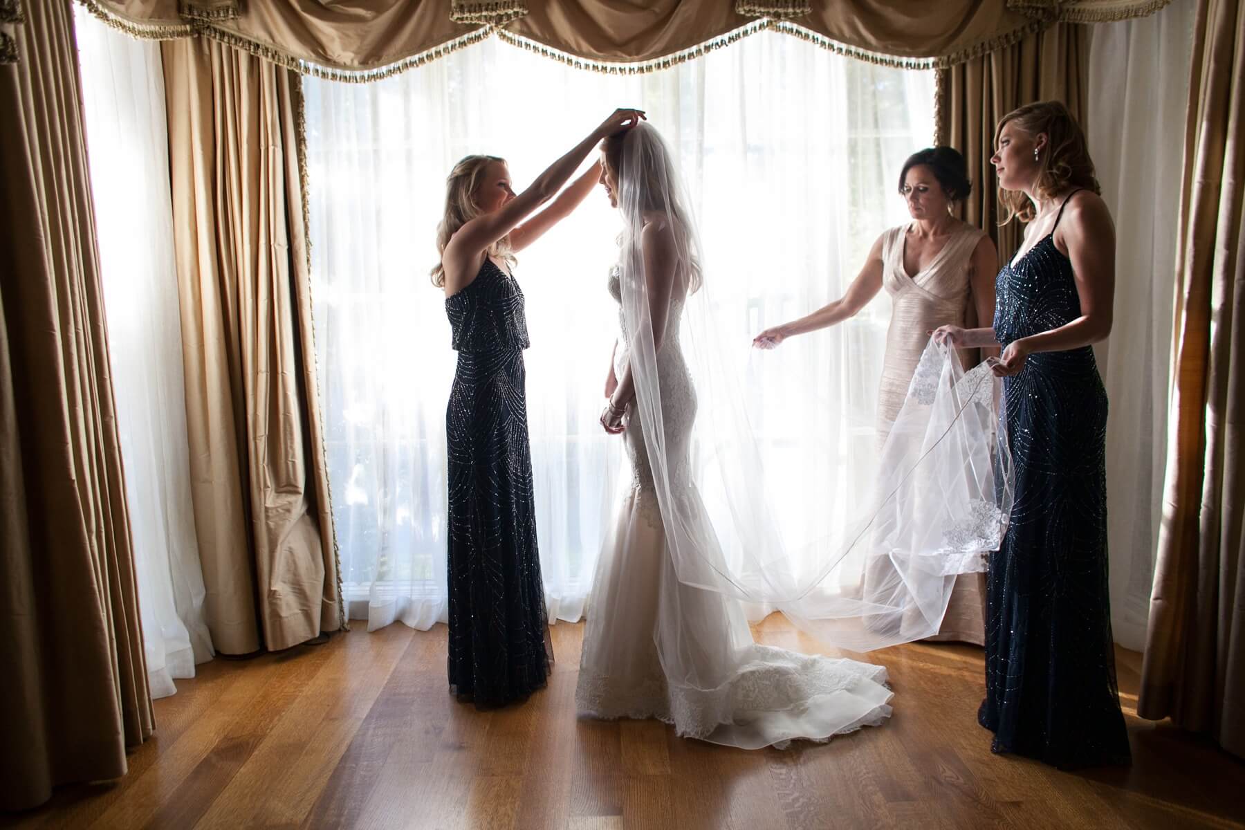 Stephanie’s mother surprised her by sewing a sapphire pendant into her dress to serve as her something blue — and borrowed and old! The pendant came from a ring Stephanie’s grandfather wore, a special way for her to include her deceased grandparents.
