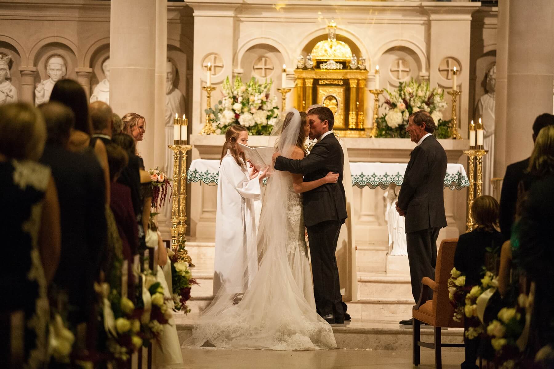 Stephanie says that “walking back up the aisle after our first kiss as a married couple was the best feeling.” The couple rode in a party bus to the reception with their wedding party, who danced and drank champagne the entire route.