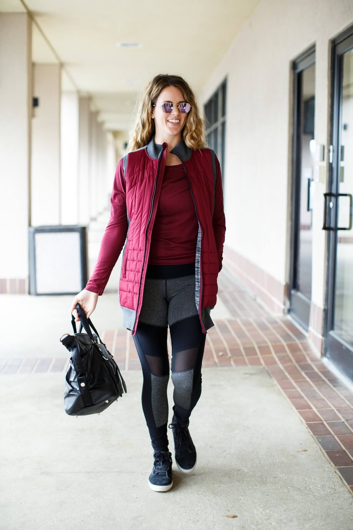 From Heather Boutique and Spa, Margaux wears MPG center tights, $76; MPG Chia top, $52; MPG vest, $90; MPG gym bag, $90, and her own shoes. This long vest makes the perfect cover up over a t-shirt and tights. To add to the sporty feel of this outfit, put on a cute pair of high-top tennis shoes.