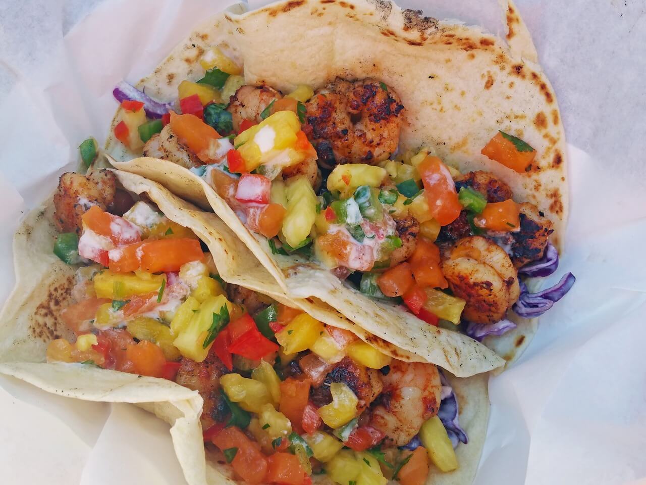 These colorful shrimp tacos with mango salsa from Snapper Grabber’s Coastal Kitchen are to-die-for! These colorful shrimp tacos with mango salsa from Snapper Grabber’s Coastal Kitchen are to-die-for!