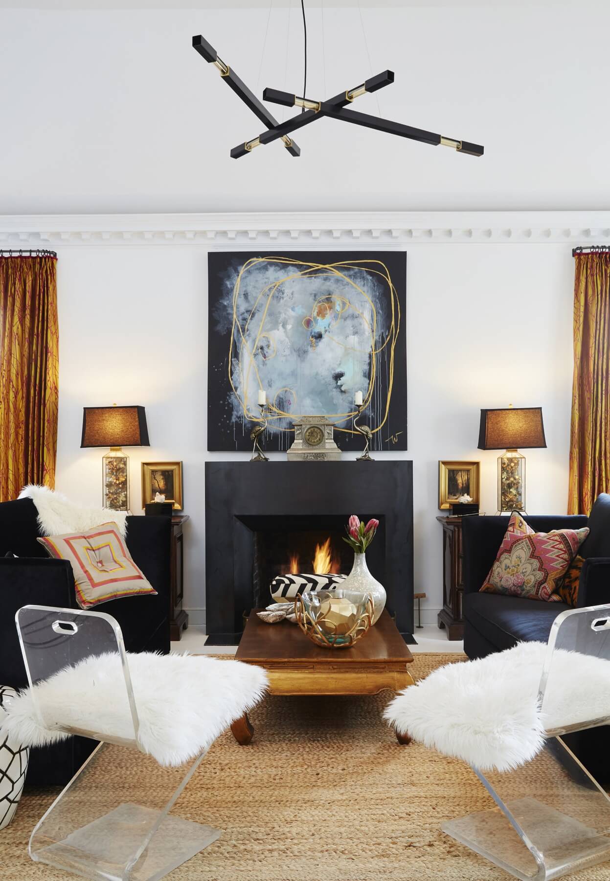 Em's daughter, Wellon Bridgers is the artist behind the striking work above the mantel. The asymmetrical "Stilk" lighting fixture by Daikon is a distinct contemporary statement piece. Em's daughter, Wellon Bridgers is the artist behind the striking work above the mantel. The asymmetrical "Stilk" lighting fixture by Daikon is a distinct contemporary statement piece.