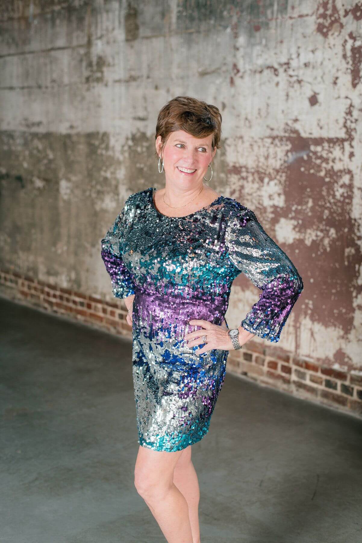 From Mia Moda Boutique: Multicolor mermaid sequin dress, $89; CZ hoop earrings, $29. 