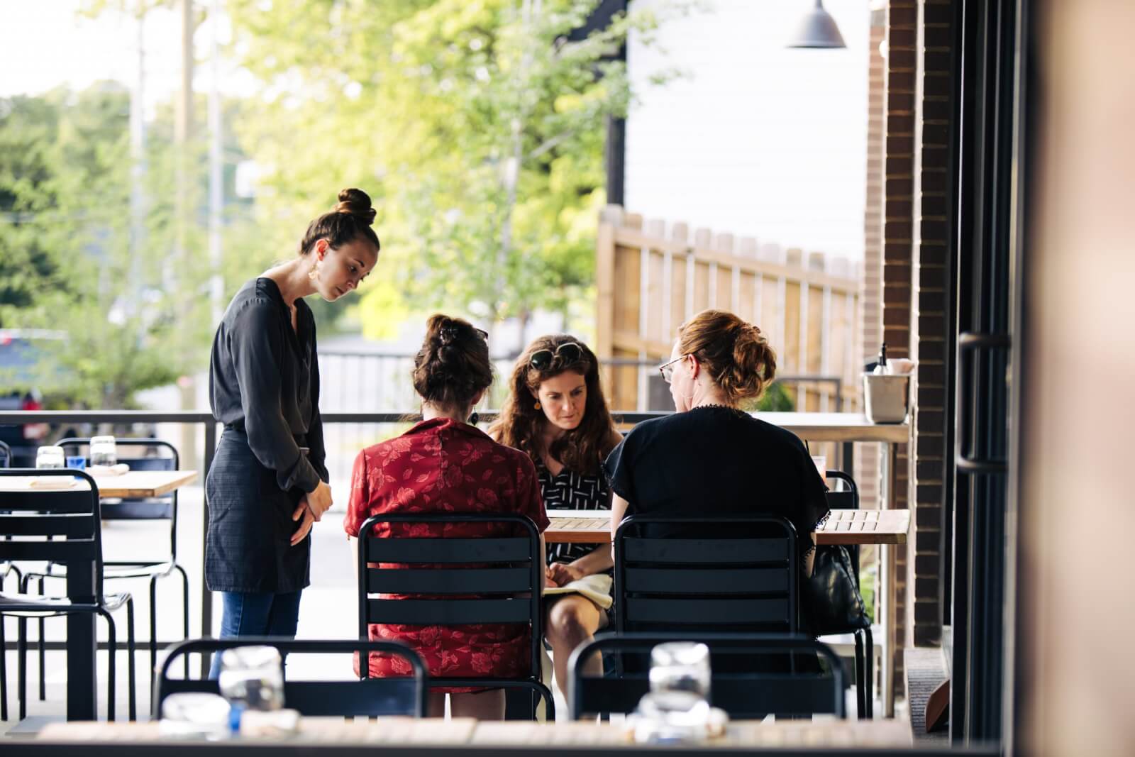 Serving taking orders on answer.'s patio in Sylvan Park