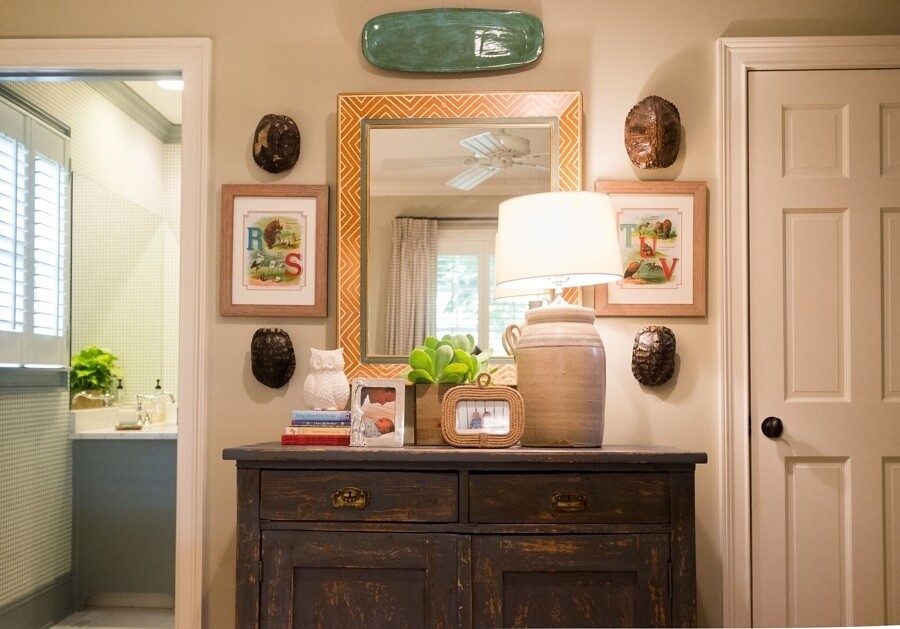 A dark-blue chest in Henry’s room was a Scott’s Antique Market find. For wall décor, Maggie framed pages from an old alphabet book, and displayed discarded turtle shells her brother and father found on walks.  