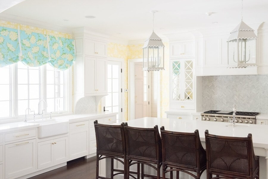 “We wanted to bring in yellow in the kitchen, but not too strong,” says Bethany. “This soft, buttery-yellow wallpaper from Clarence House (clarencehouse.com) was the perfect choice; It’s an all-time favorite.” Other great features include Lilly Pulitzer fabric (leejofa.com) on roman shades, soft gray lanterns with a scalloped trim, and mirrored cabinets. “We wanted to bring in yellow in the kitchen, but not too strong,” says Bethany. “This soft, buttery-yellow wallpaper from Clarence House (clarencehouse.com) was the perfect choice; It’s an all-time favorite.” Other great features include Lilly Pulitzer fabric (leejofa.com) on roman shades, soft gray lanterns with a scalloped trim, and mirrored cabinets.