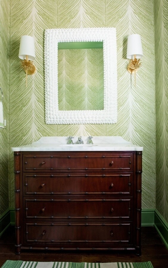 “Who doesn’t love a wallpapered powder room?” asks Bethany. “The green palm paper is lush and fabulous; we loved the color so much that we painted the baseboards the same green. Green is everywhere in our landscape here … It’s part of the beauty of Sea Island.” “Who doesn’t love a wallpapered powder room?” asks Bethany. “The green palm paper is lush and fabulous; we loved the color so much that we painted the baseboards the same green. Green is everywhere in our landscape here … It’s part of the beauty of Sea Island.”