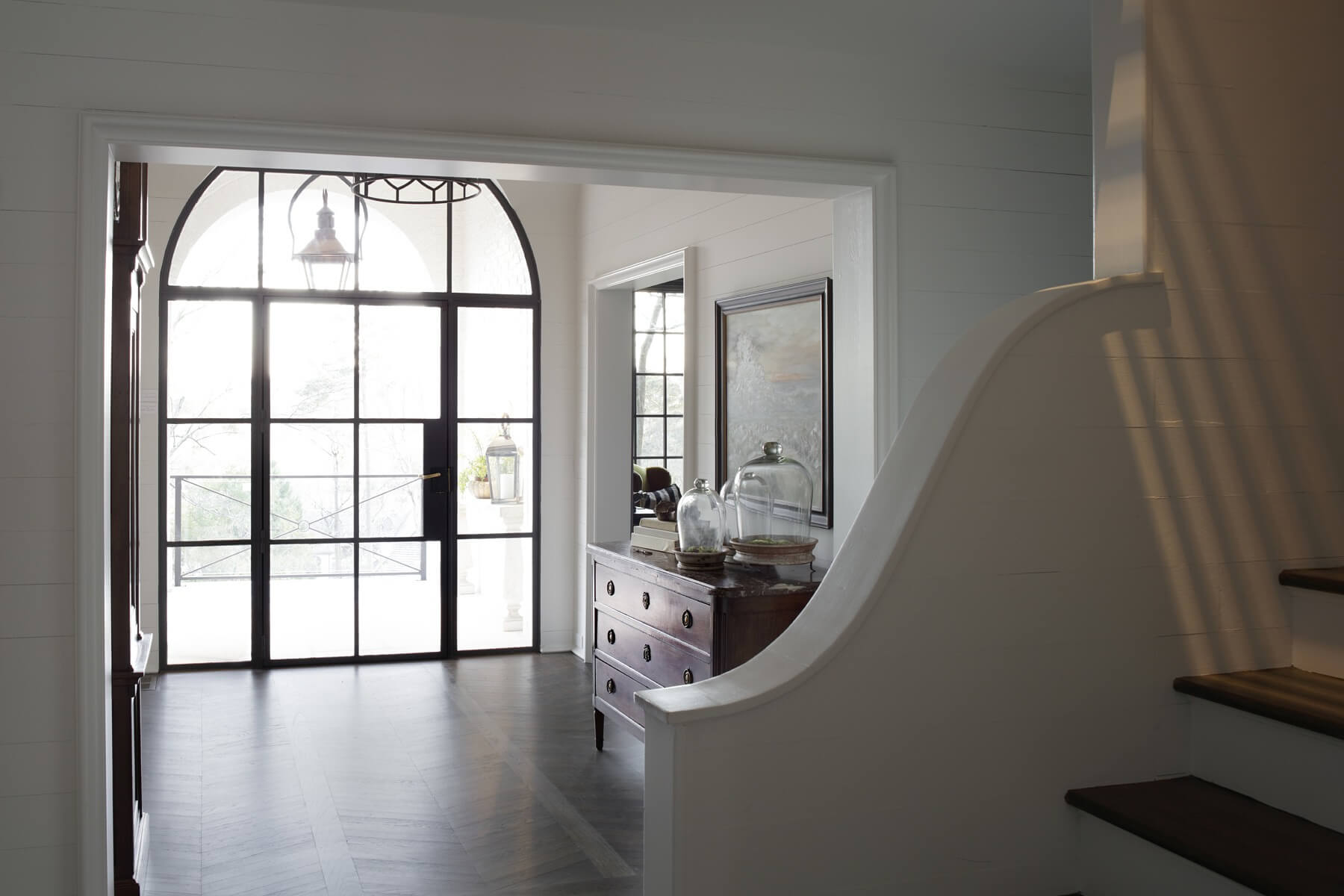 Because the property boasts an impressive view overlooking Country Club Road, Joanna says providing ample natural light through a plethora of windows, like this airy, light-filled foyer, was essential to the home’s layout. Because the property boasts an impressive view overlooking Country Club Road, Joanna says providing ample natural light through a plethora of windows, like this airy, light-filled foyer, was essential to the home’s layout.