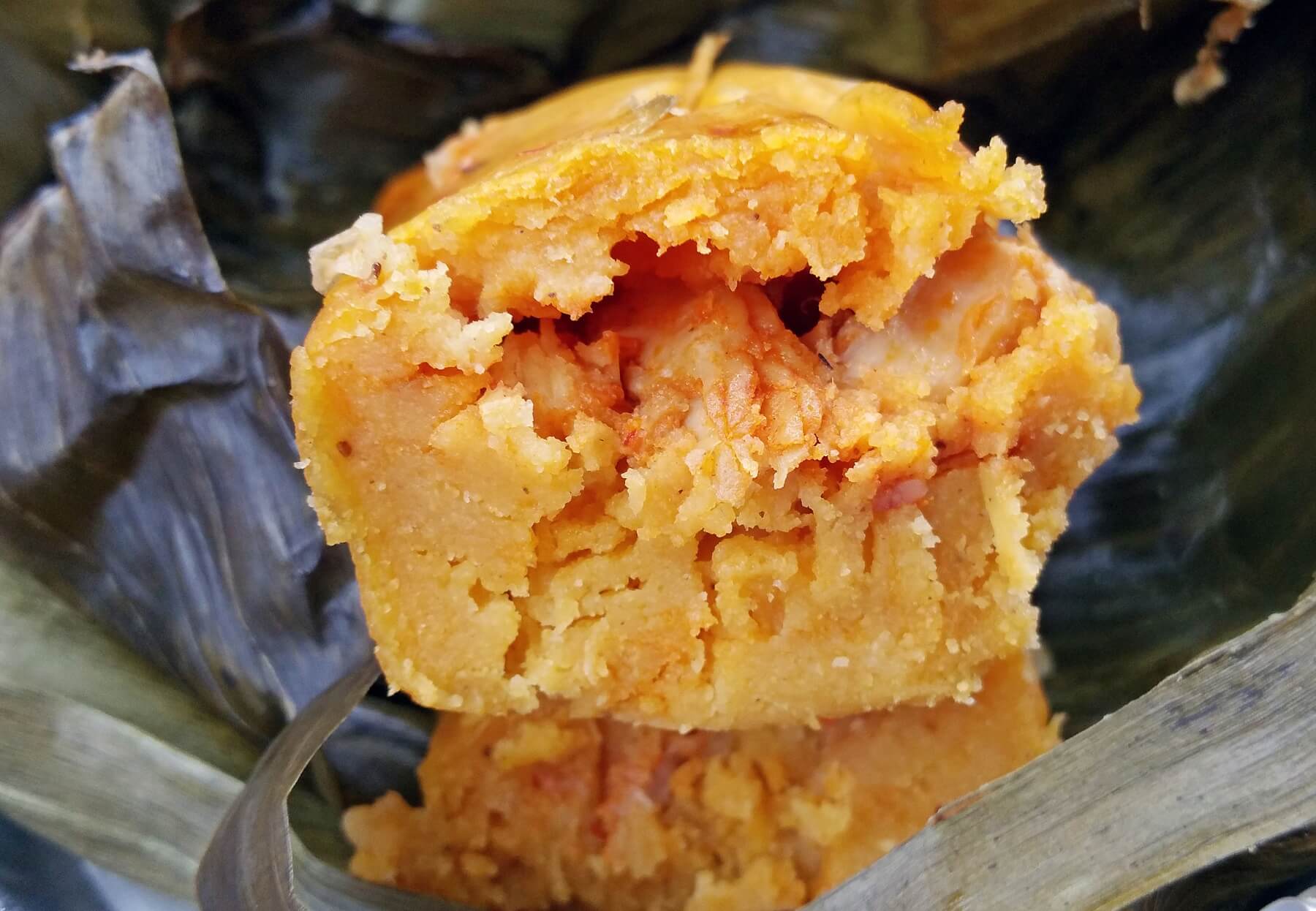 The corn masa is more starchy in the Peruvian tamale. This one is filled with chicken and a red sauce. The corn masa is more starchy in the Peruvian tamale. This one is filled with chicken and a red sauce.