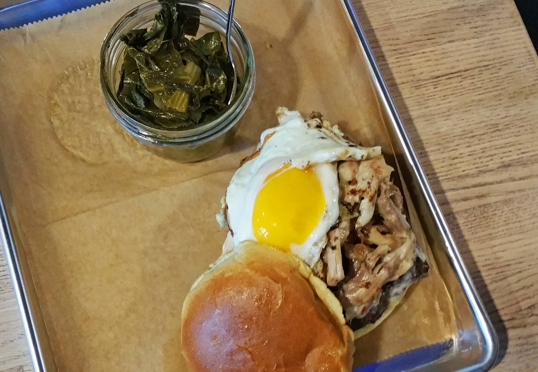 "The Farm" burger features a short rib blend patty on a brioche bun with a smear of smoky mayo, topped with pork belly, duck confit and smoked turkey, drizzled in green chile queso,topped with a sunny-side-up egg and sprinkled with cracklins. "The Farm" burger features a short rib blend patty on a brioche bun with a smear of smoky mayo, topped with pork belly, duck confit and smoked turkey, drizzled in green chile queso,topped with a sunny-side-up egg and sprinkled with cracklins.