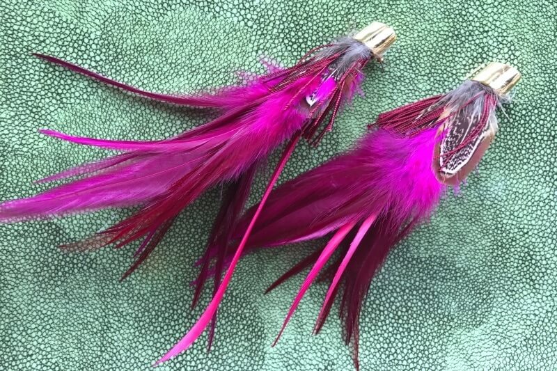 Feathers are a timeless jewelry look. Find these striking magenta feathered earrings for $200 at Social. Feathers are a timeless jewelry look. Find these striking magenta feathered earrings for $200 at Social.