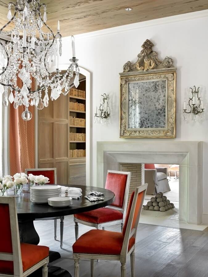 Melanie played with light and dark, old and new in this chic dining room, with its distinctive see-through fireplace into the adjacent library. Image: Emily Followill