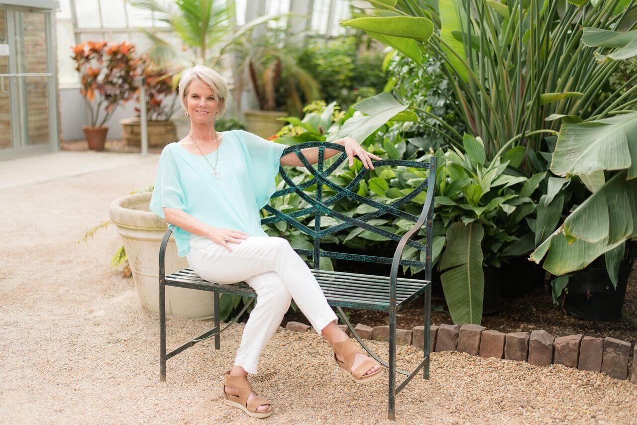 From Town and Country Clothes: Alison Sheri aqua chiffon layer top, $94; White JAG jean, $92; Laurel Bassett geode necklace, $108.