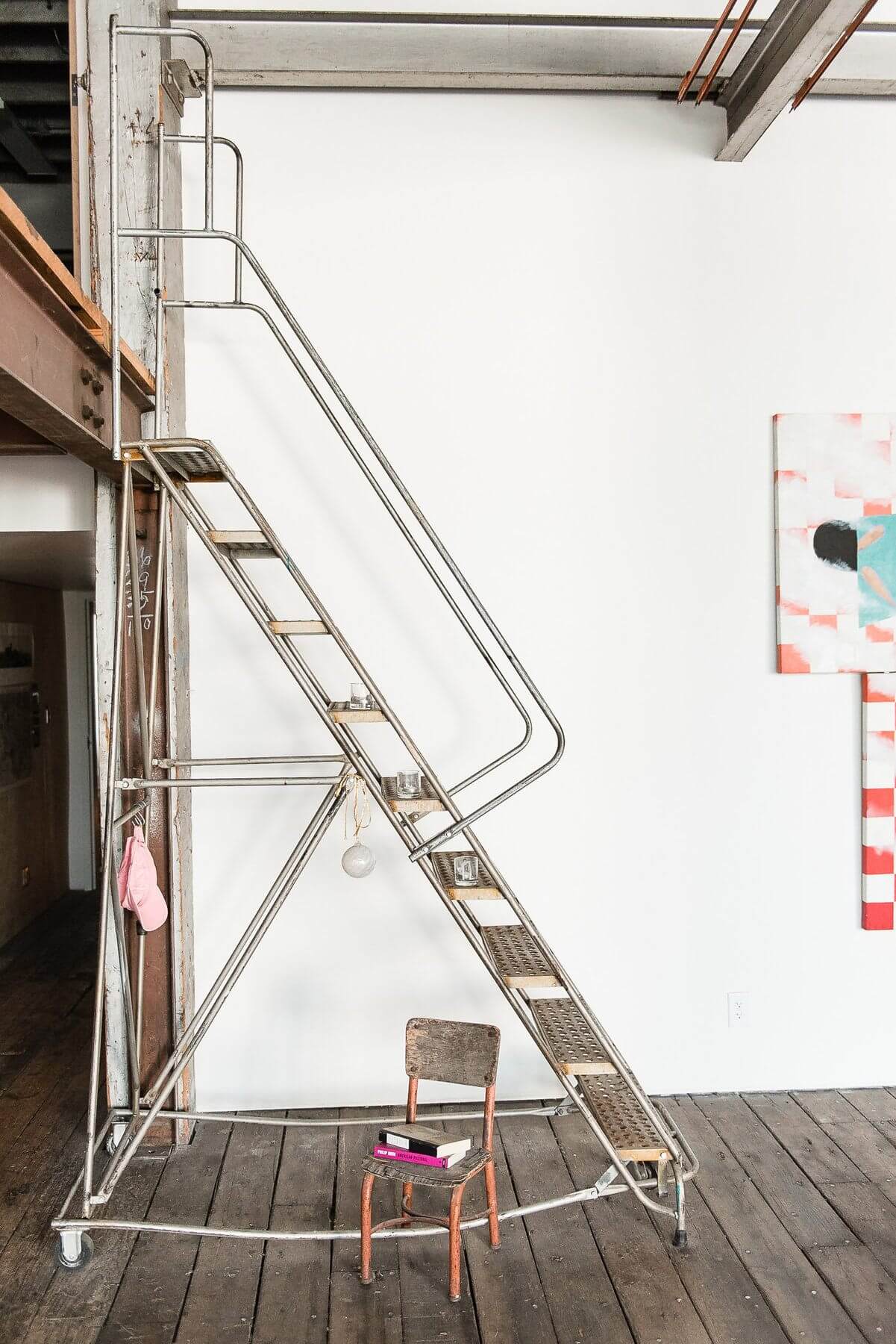 The rolling staircase to upstairs has an old-school charm that can't be denied. The rolling staircase to upstairs has an old-school charm that can't be denied.