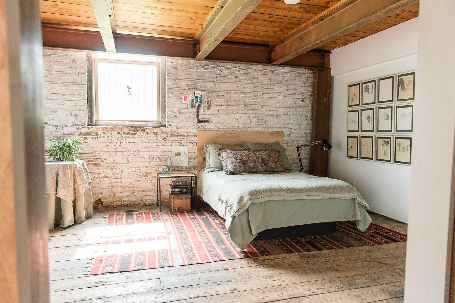 The guest bedroom exudes a rustic warmth that makes us want to cuddle up with a great book! The guest bedroom exudes a rustic warmth that makes us want to cuddle up with a great book!The guest bedroom exudes a rustic warmth that makes us want to cuddle up with a great book!