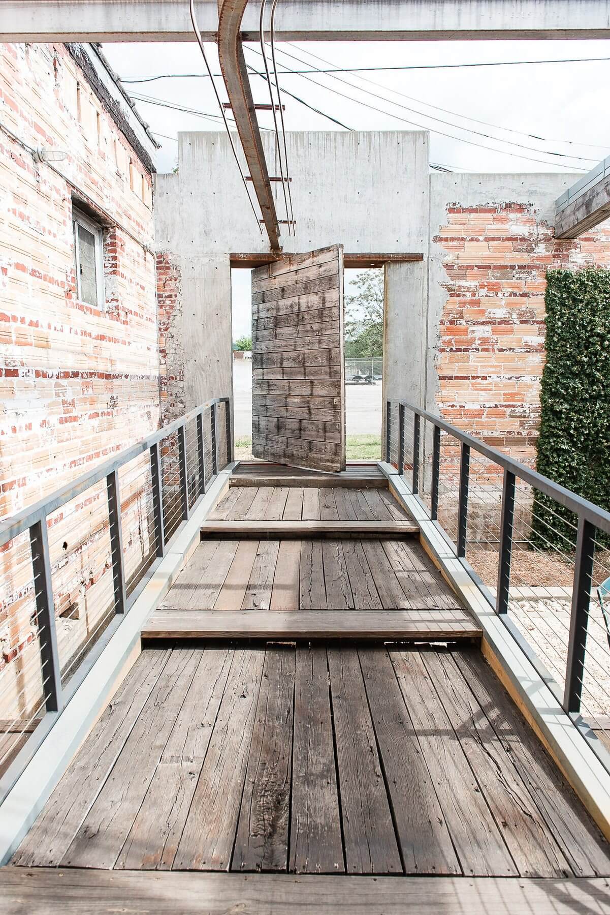 We love the exposed clay tile and salvaged wood in this courtyard vignette. We love the exposed clay tile and salvaged wood in this courtyard vignette.