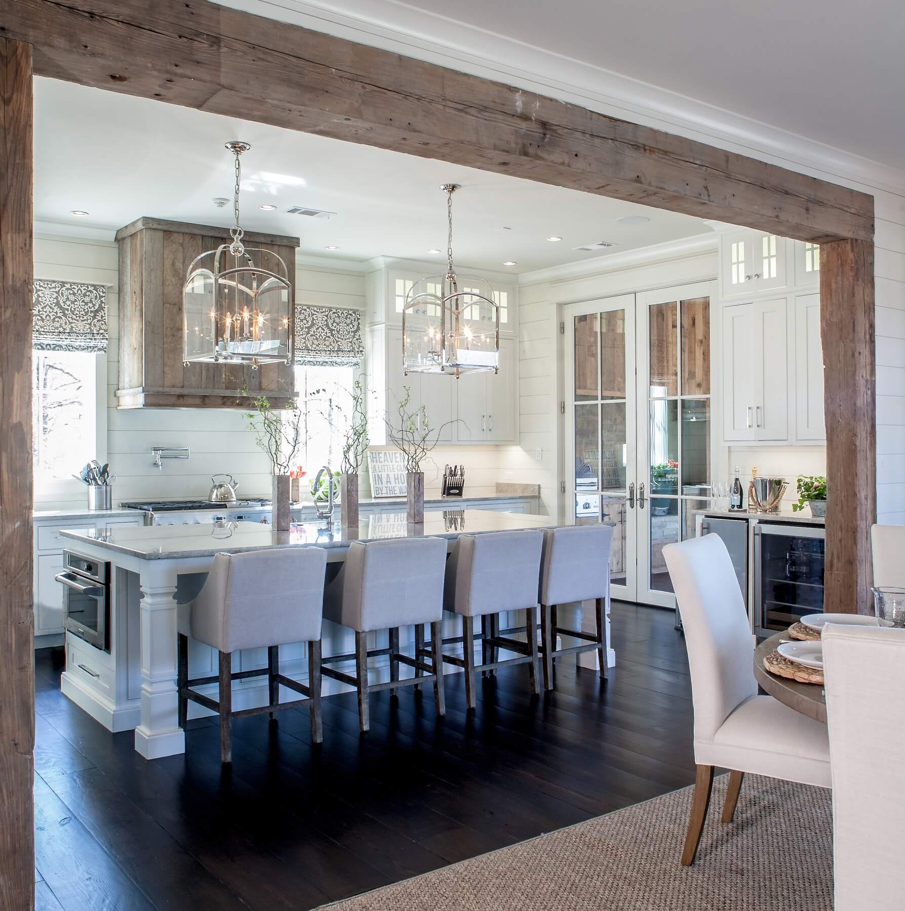 Large windows, gleaming countertops and smart lighting make this dreamy kitchen positively sparkle.
