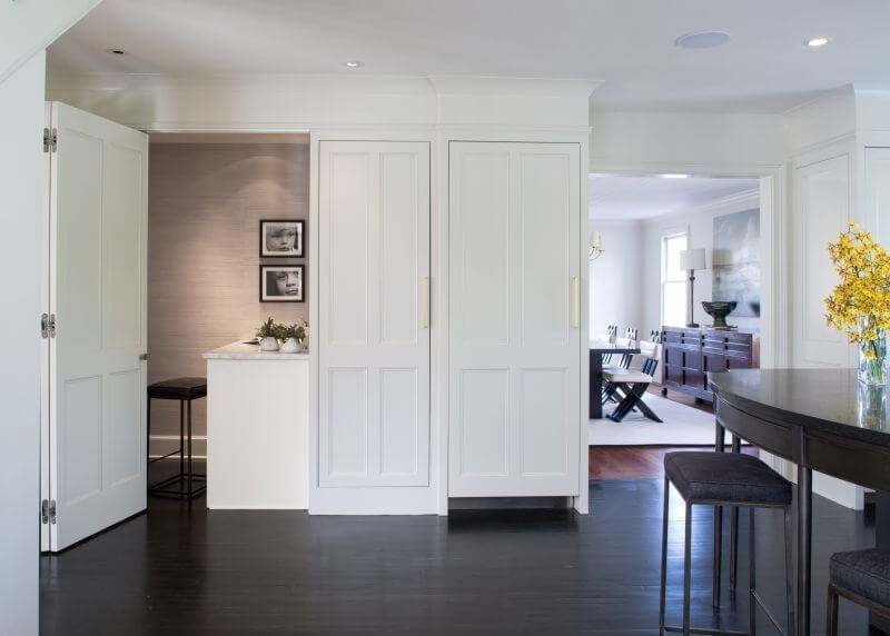 This nifty, hideaway home office can be closed off during a party or open for its users to stay connected to family life.