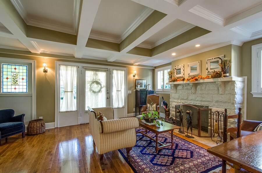 The living room welcomes you into the home. Coffered ceiling, recessed lighting, beautiful hardwoods and a stunning stone fireplace are just a few of the magnificent features found inside!