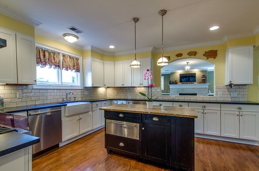 The bright kitchen is filled with modern conveniences that any homeowners looks for. From tons of cabinet storage to the stone slap-topped island, this professional-grade kitchen is top-of-the-line!