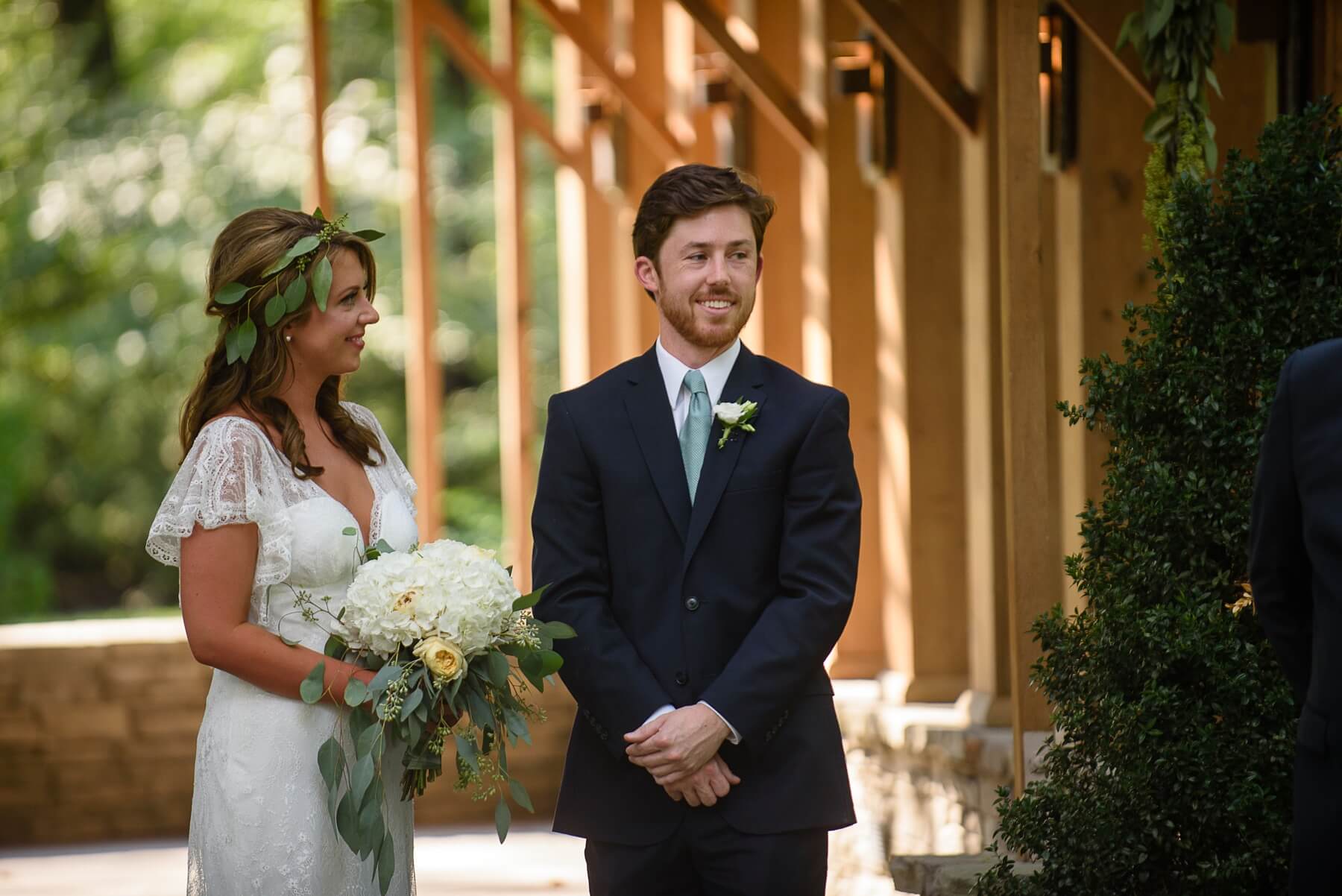The groom wore a navy suit by Calvin Klein. The couple chose not to have a color scheme. “We wanted an organic, casual setting with arrangements and décor to mirror the already wonderful vibes of the day,” explains John-Michael.