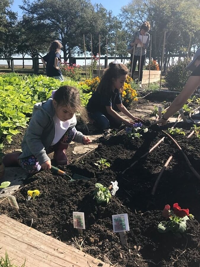 These students at The Delta School learn the art of growing their own food. Image: Facebook