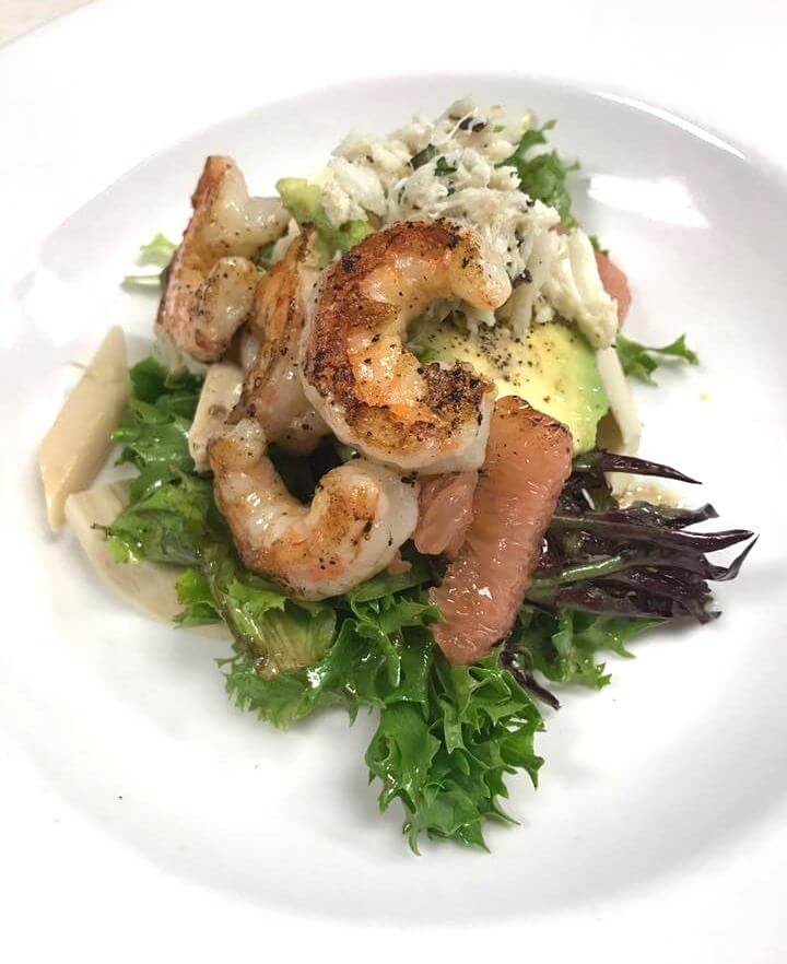 Crab stuffed avocado, grilled shrimp and grapefruit segments atop baby lettuces