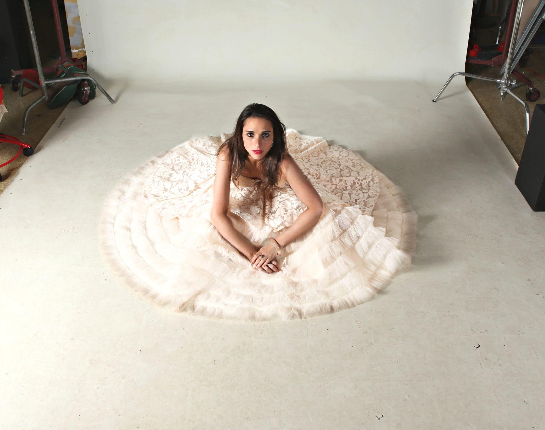 This exquisite 50s strapless, blush cotillion gown surrounds Katie in a sea of layered tulle, organza and lace. This exquisite 50s strapless, blush cotillion gown surrounds Katie in a sea of layered tulle, organza and lace.