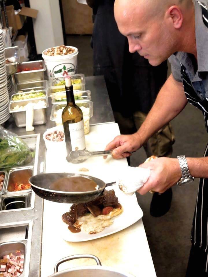 Bistro V Executive Chef Jeremy Downey's culinary chops are on display during the dinner rush in the eatery's open kitchen.