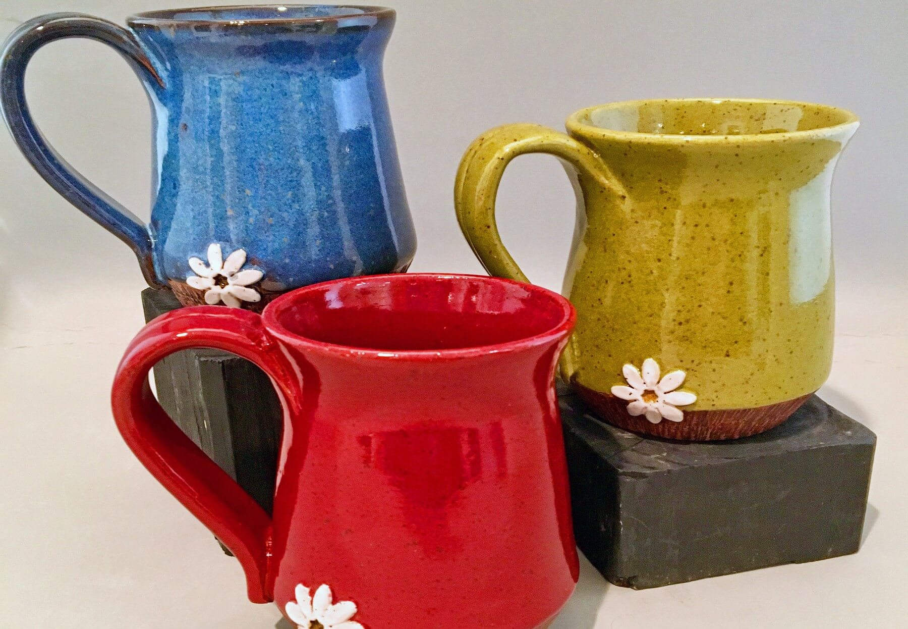 Microwave-safe "Crazy Daisy" pottery mugs, $26, at marybpottery.com
