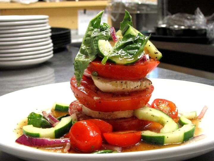 Organic tomatoes, fresh mozzarella, cucumber, fresh basil and red onion salad