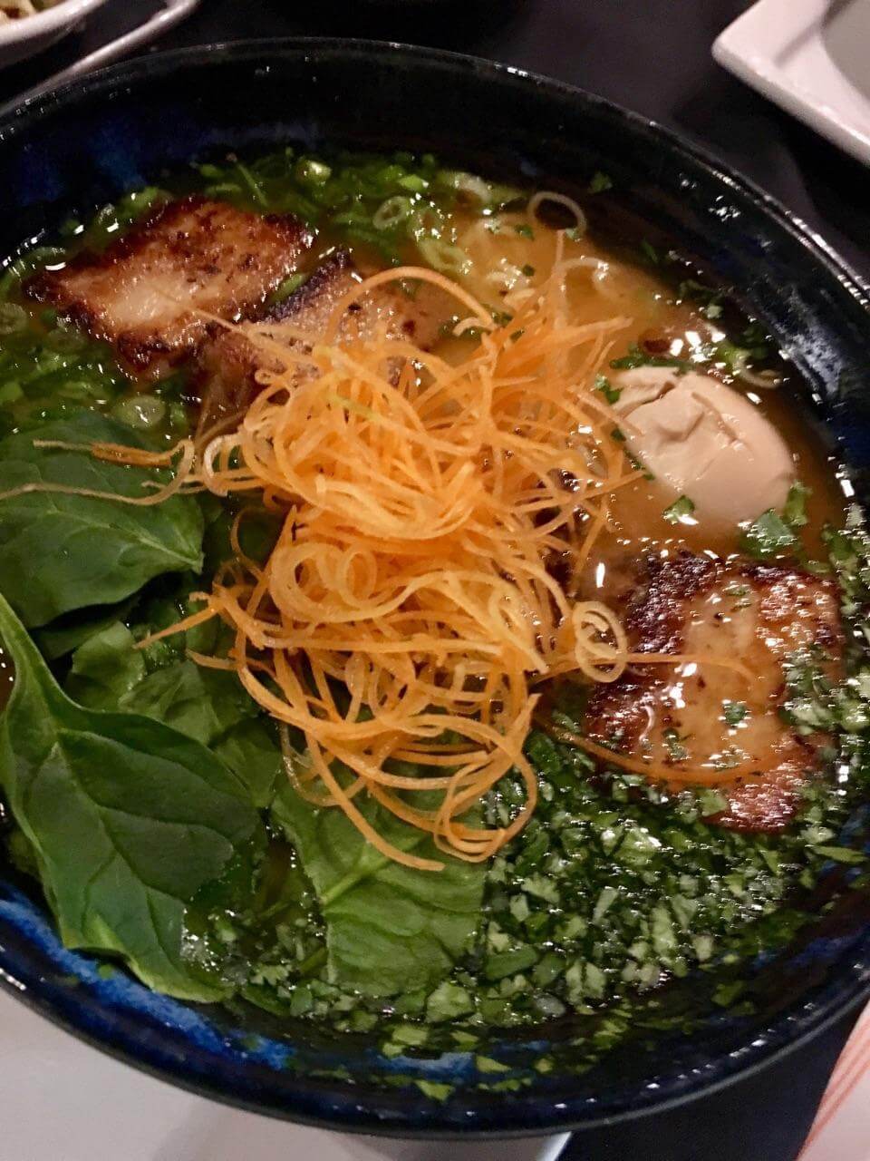 Abhi's pork belly ramen bowl features a savory pork broth, what noodles, carrots, cilantro, green onions, bean sprouts, Shiitake mushrooms, tree ear mushrooms and a soft-boiled egg. Image: Abhi Eatery + Bar Abhi's pork belly ramen bowl features a savory pork broth, what noodles, carrots, cilantro, green onions, bean sprouts, Shiitake mushrooms, tree ear mushrooms and a soft-boiled egg. Image: Abhi Eatery + Bar