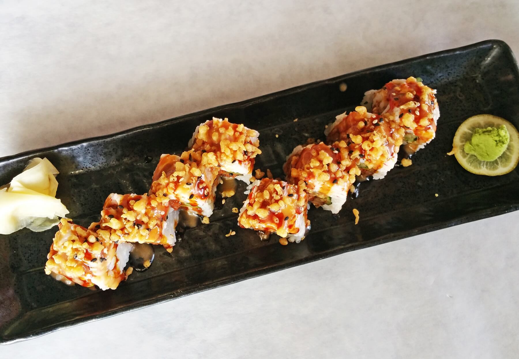 The "Sexy Lady" sushi roll includes spicy tuna, cucumber, tempura topped with crab, Abhi aioli and eel sauce. The "Sexy Lady" sushi roll includes spicy tuna, cucumber, tempura topped with crab, Abhi aioli and eel sauce.