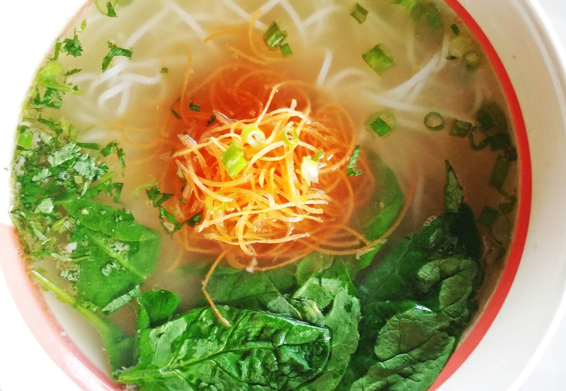 Thukpa is a Tibetan-style noodle soup with rice noodles, chicken broth, carrots, spinach, green onions and cilantro. Thukpa is a Tibetan-style noodle soup with rice noodles, chicken broth, carrots, spinach, green onions and cilantro.