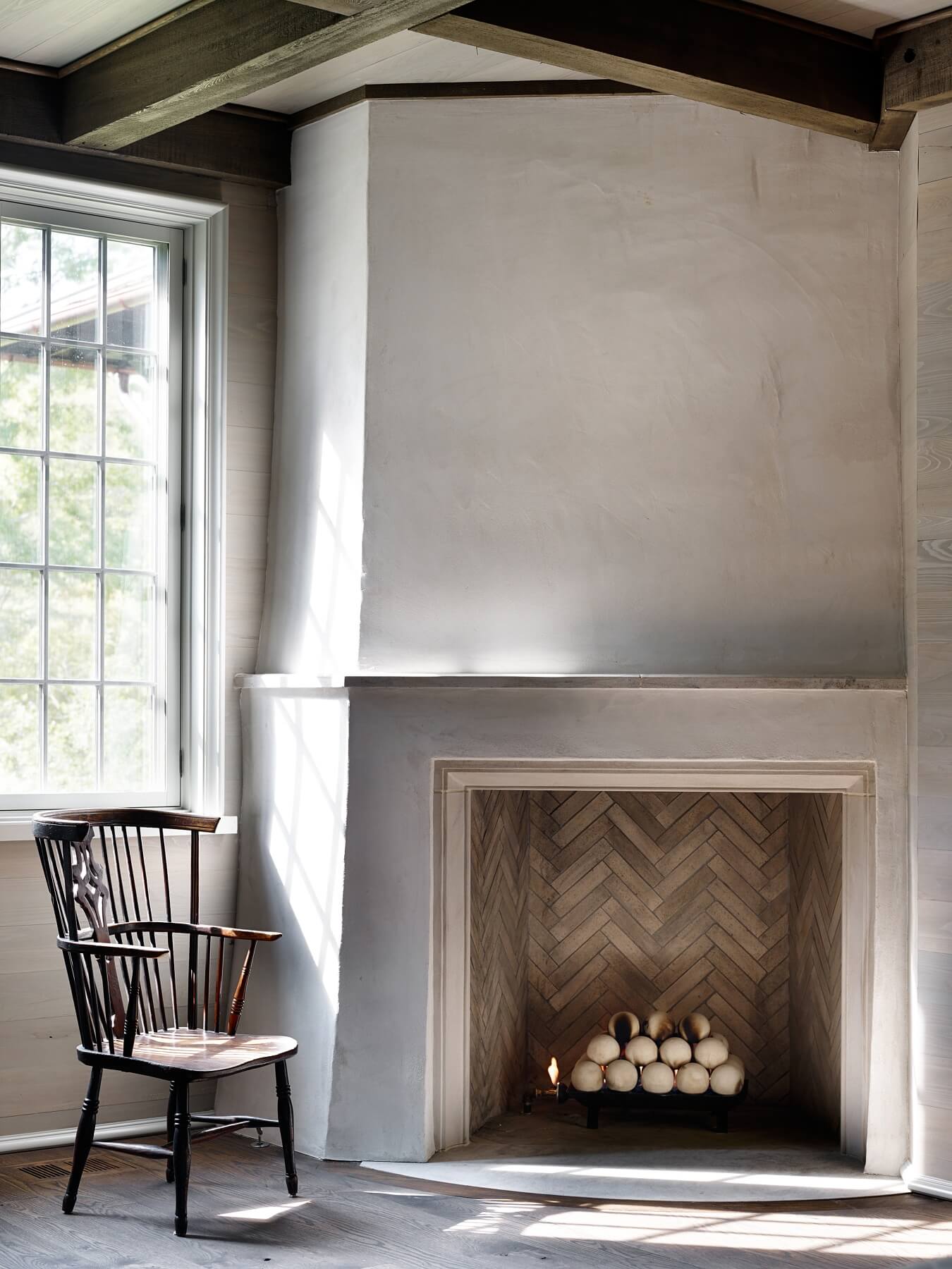 We love the simplicity of this corner fireplace, where it seems as if the "Girl with a Pearl Earring" just walked away.