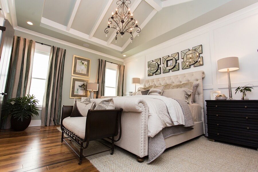 The master bedroom keeps things serene and neutral with a natural-hued palette with a few black accents for just a little drama. 