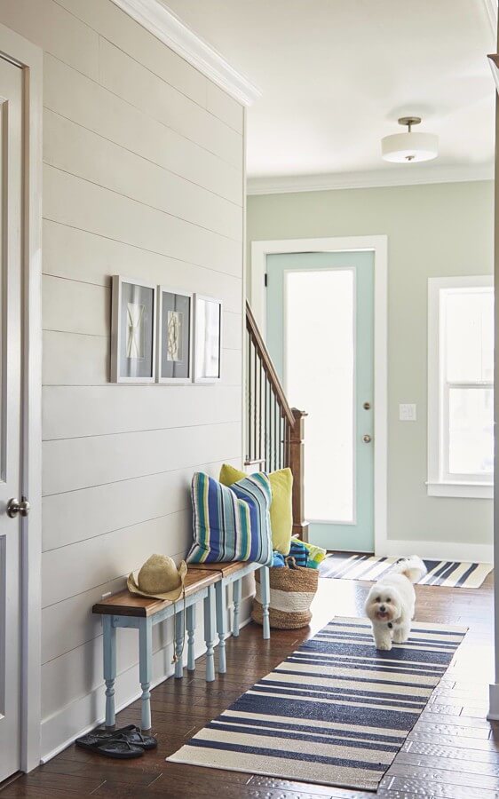 Kristin added a less-expensive version of ship lap to the front hallway and kitchen as a way to add architectural charm.