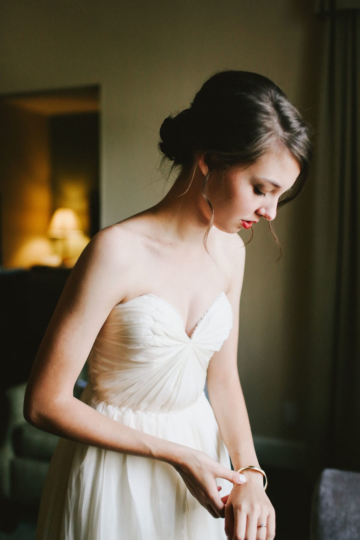 Natalie chose simple, classic gold jewelry to go with her wedding gown — the very picture of subtle elegance.