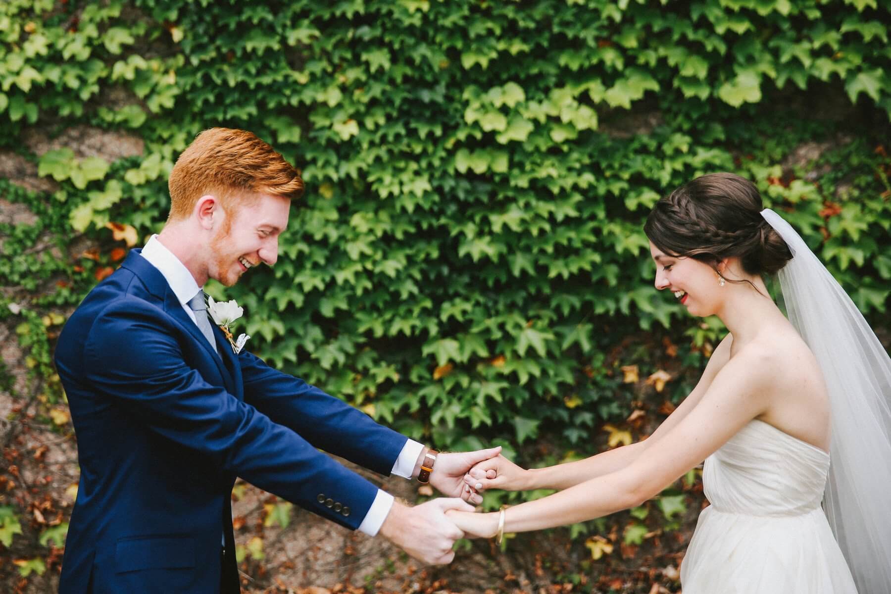 The bride admires her dapper groom while the groom marvels at his stunning bride!