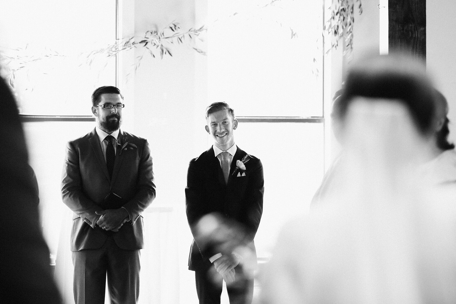Adam smiles at Natalie as she walks down the aisle toward him, for a super-sweet ceremony moment!
