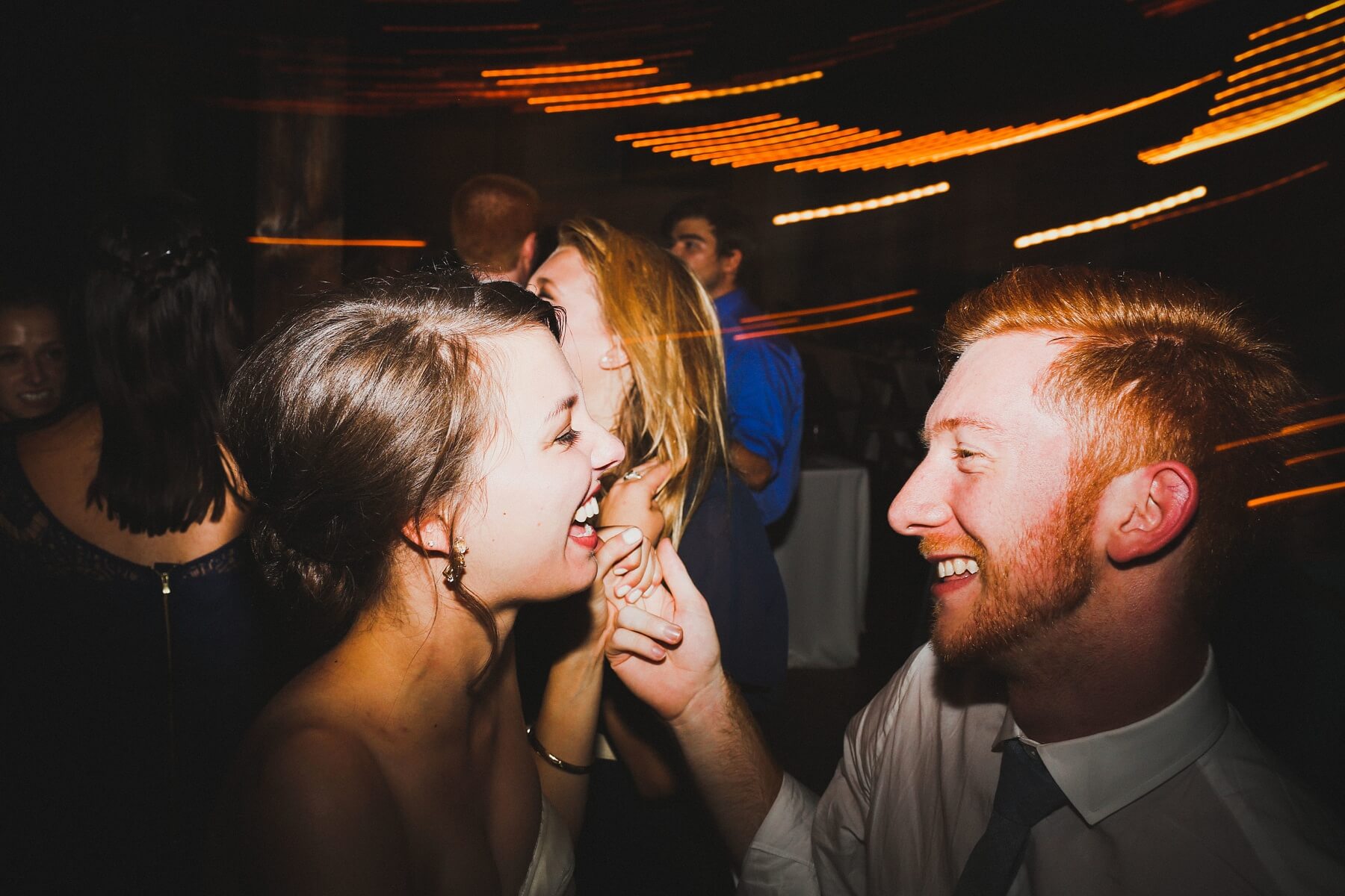 The lovebirds laugh and dance the night away!
