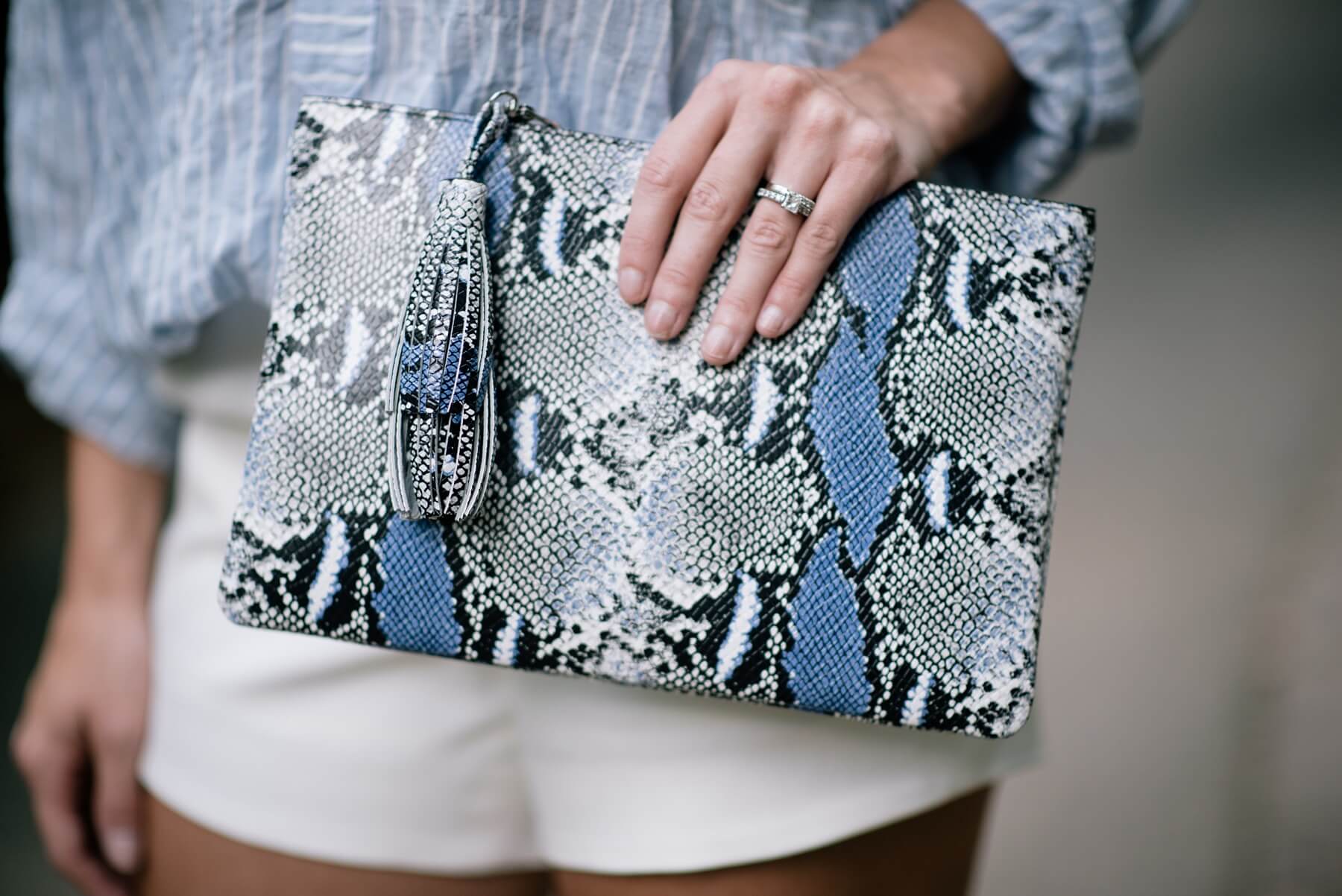 From Manhattan South: Jules Kae Jen Pouch in Blue Snake, $95. 