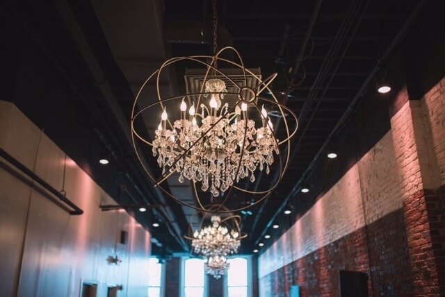 Three-foot metal orb chandeliers cast warm light in The Quarter. Three-foot metal orb chandeliers cast warm light in The Quarter.